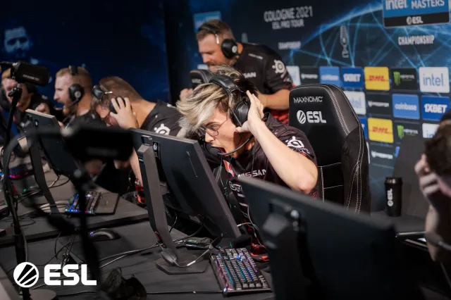 Twistzz at ESL wearing a headset while shouting with joy.