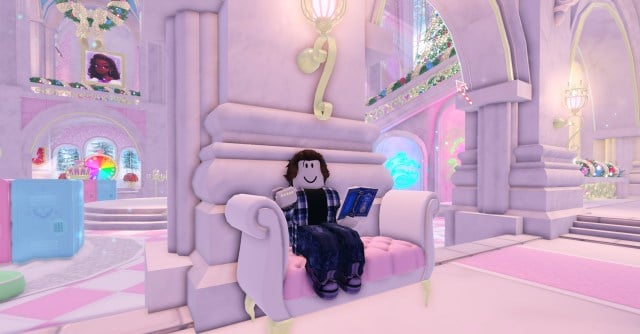 A roblox character sitting at a sofa reading a book and showing off nails