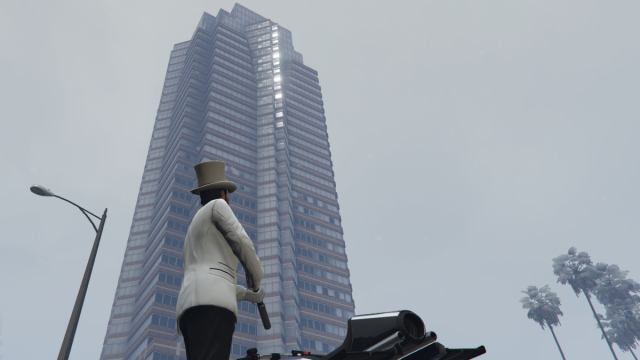 A GTA Online player looking up at Weazel Plaza.